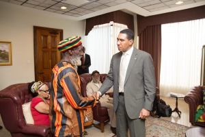 Prime Minister Andrew Holness in undated photo with member of Rastafarian community